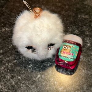 hand sanitizer and fluffy case keychain with face